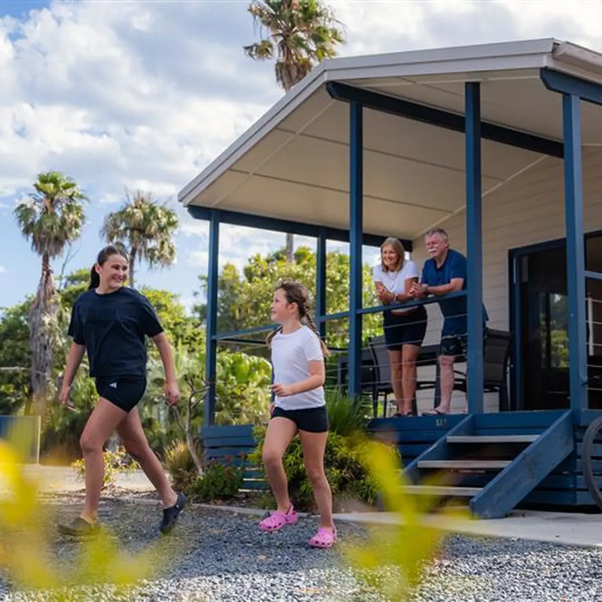 A family enjoying the cabin balcony